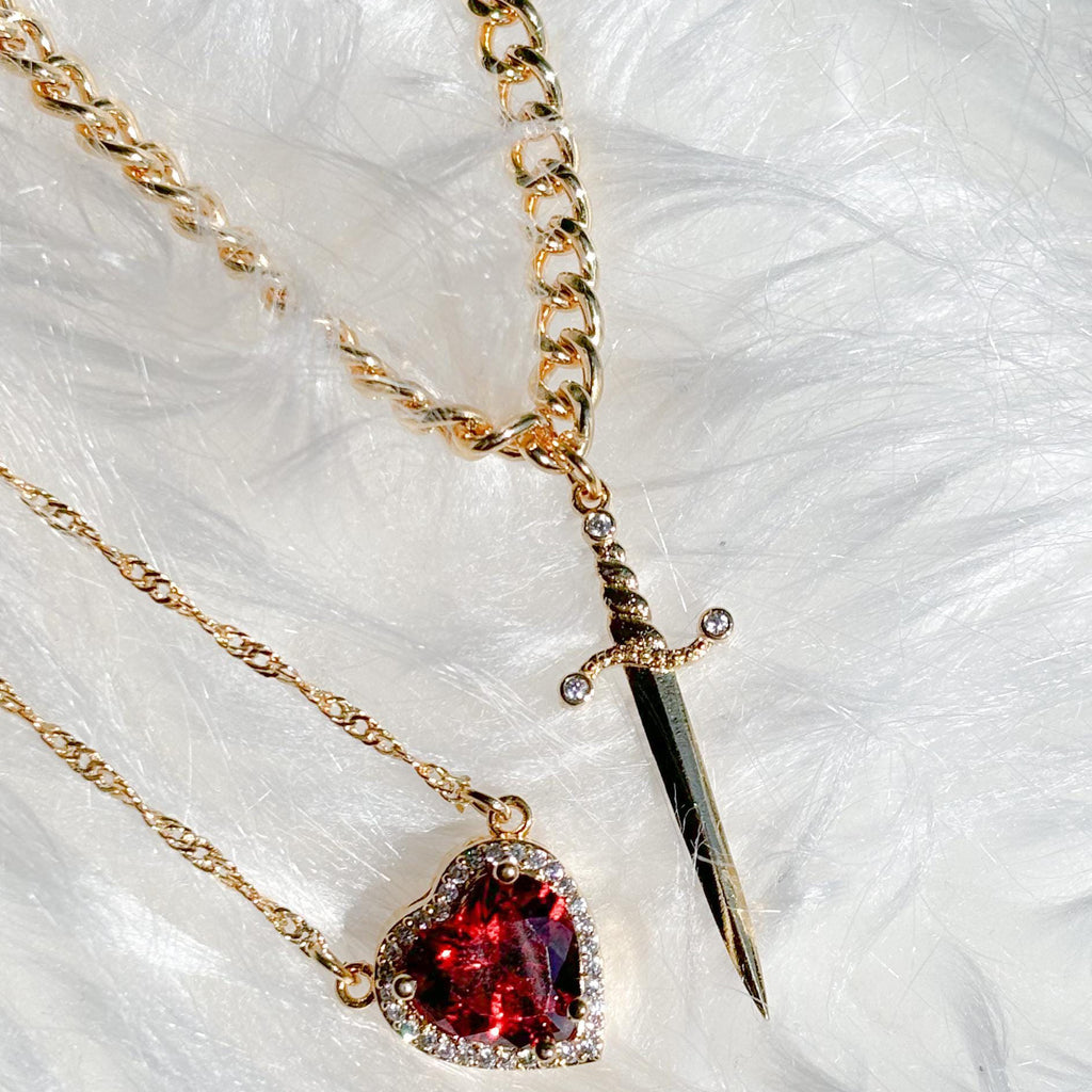 A sword through the heart necklace