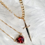 A sword through the heart necklace