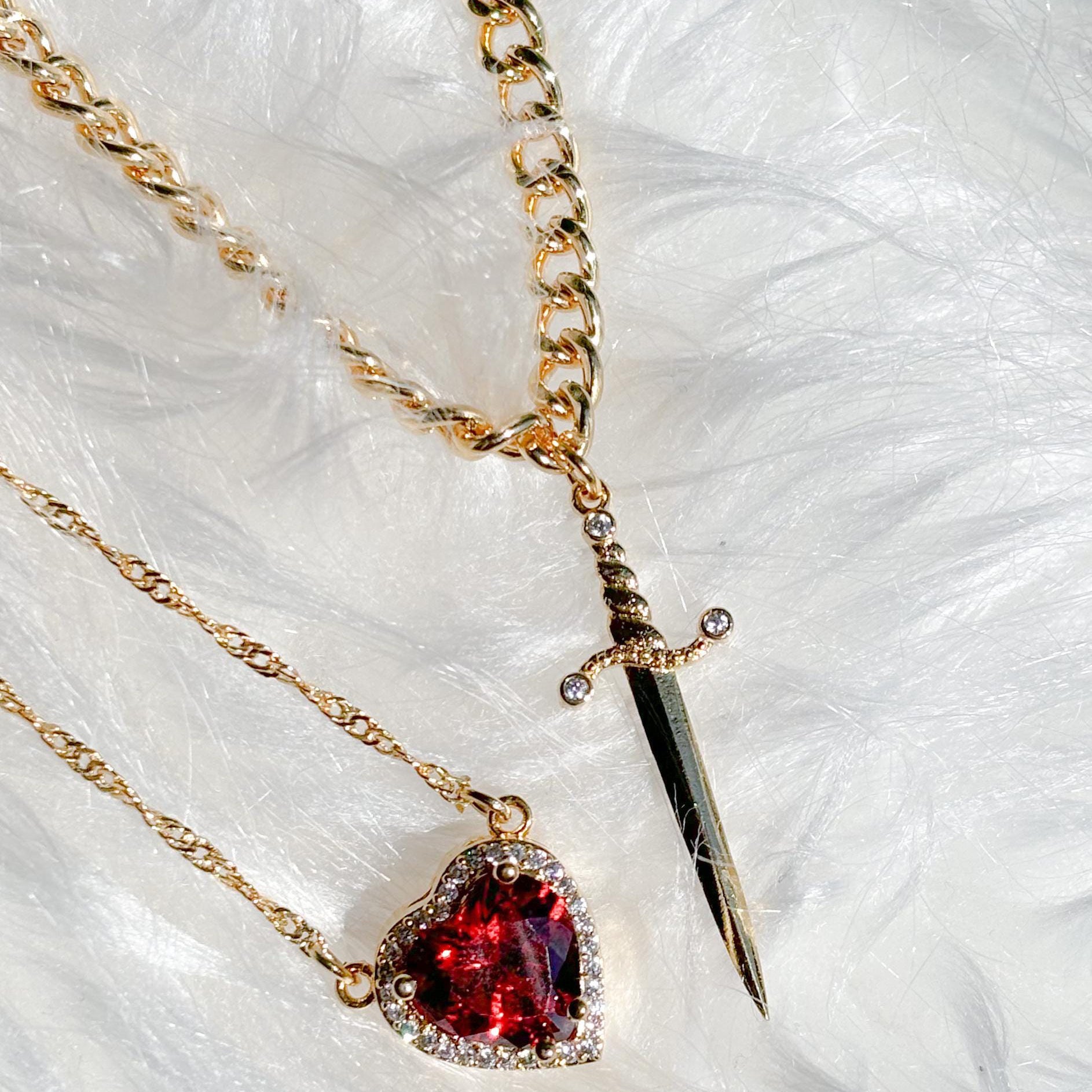 A sword through the heart necklace