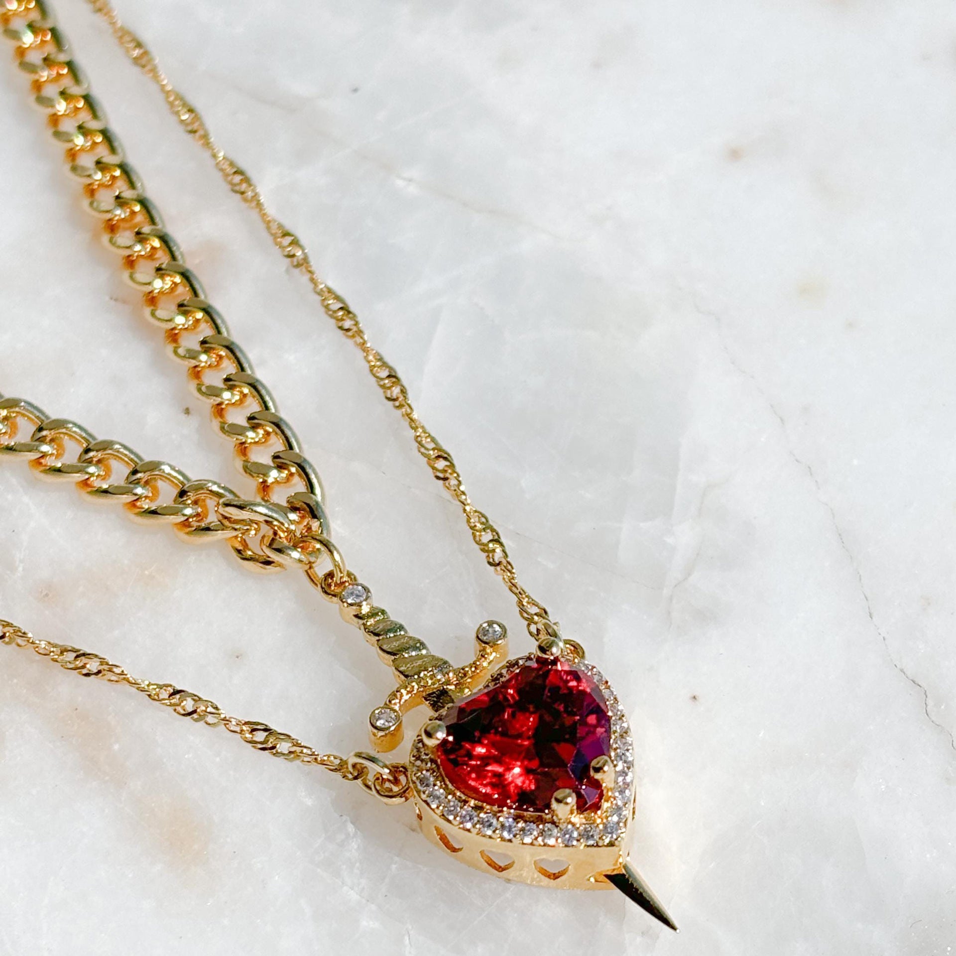 A sword through the heart necklace